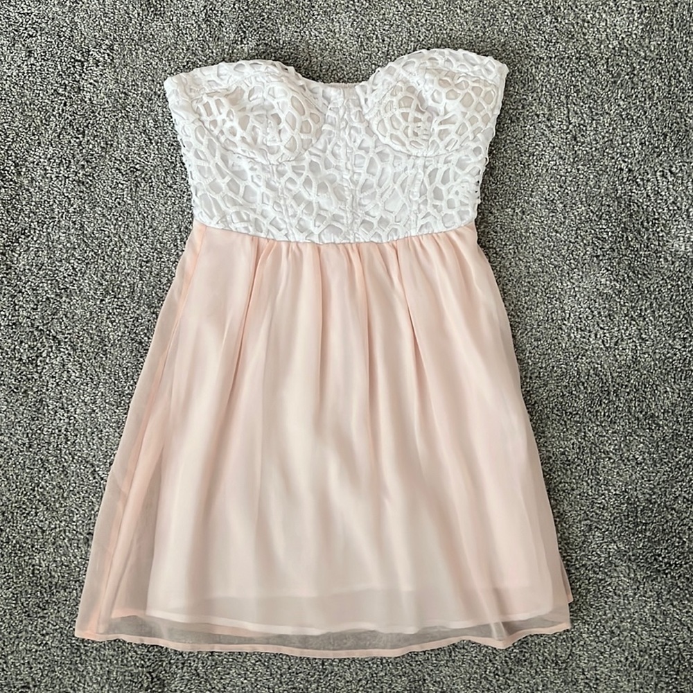 strapless white lacy corset mini dress with light pink flowy bottom